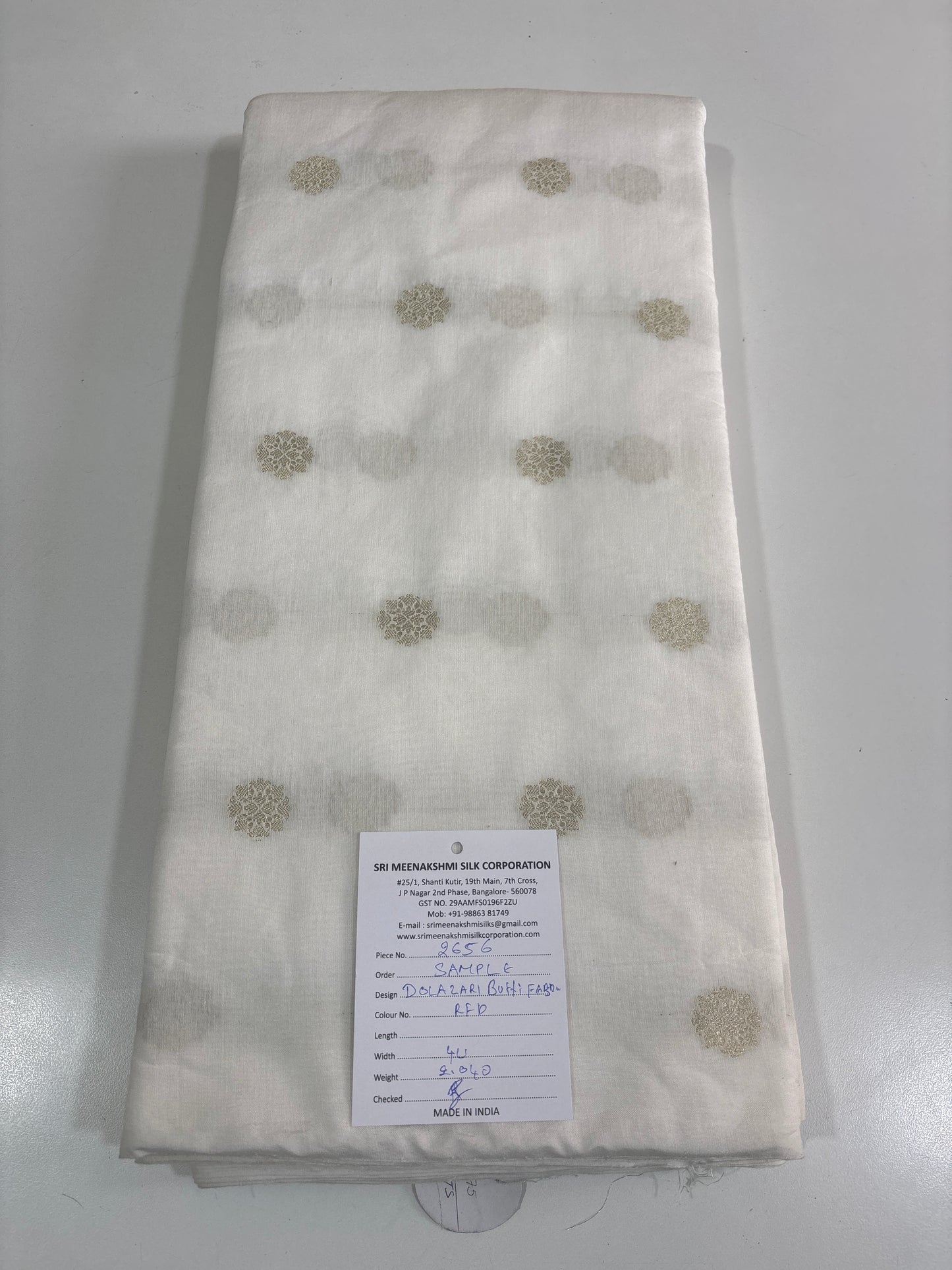 White deyable dolla  Zari butti fabric